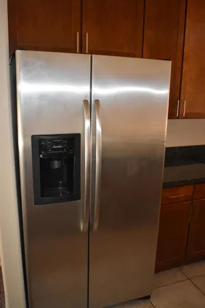 a close view of a refrigerator in kitchen and a refrigerator