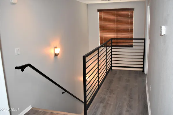 a view of a hallway with stairs