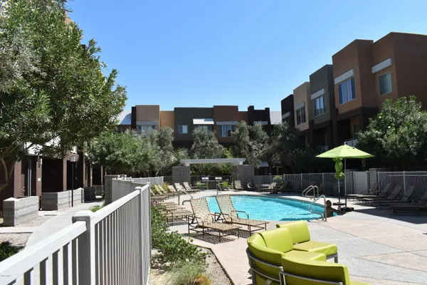 a view of a swimming pool with a patio
