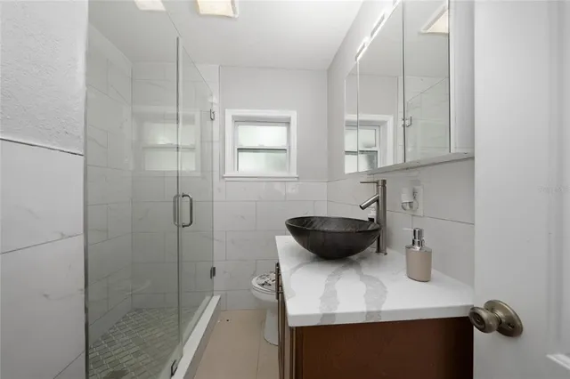a kitchen with a sink and a refrigerator