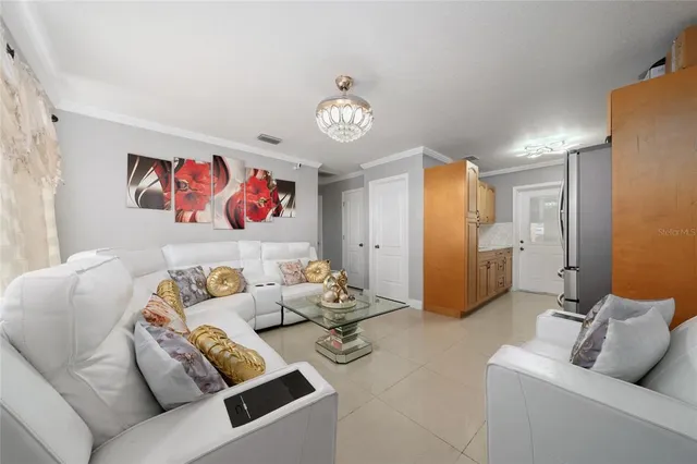 a living room with furniture and a table