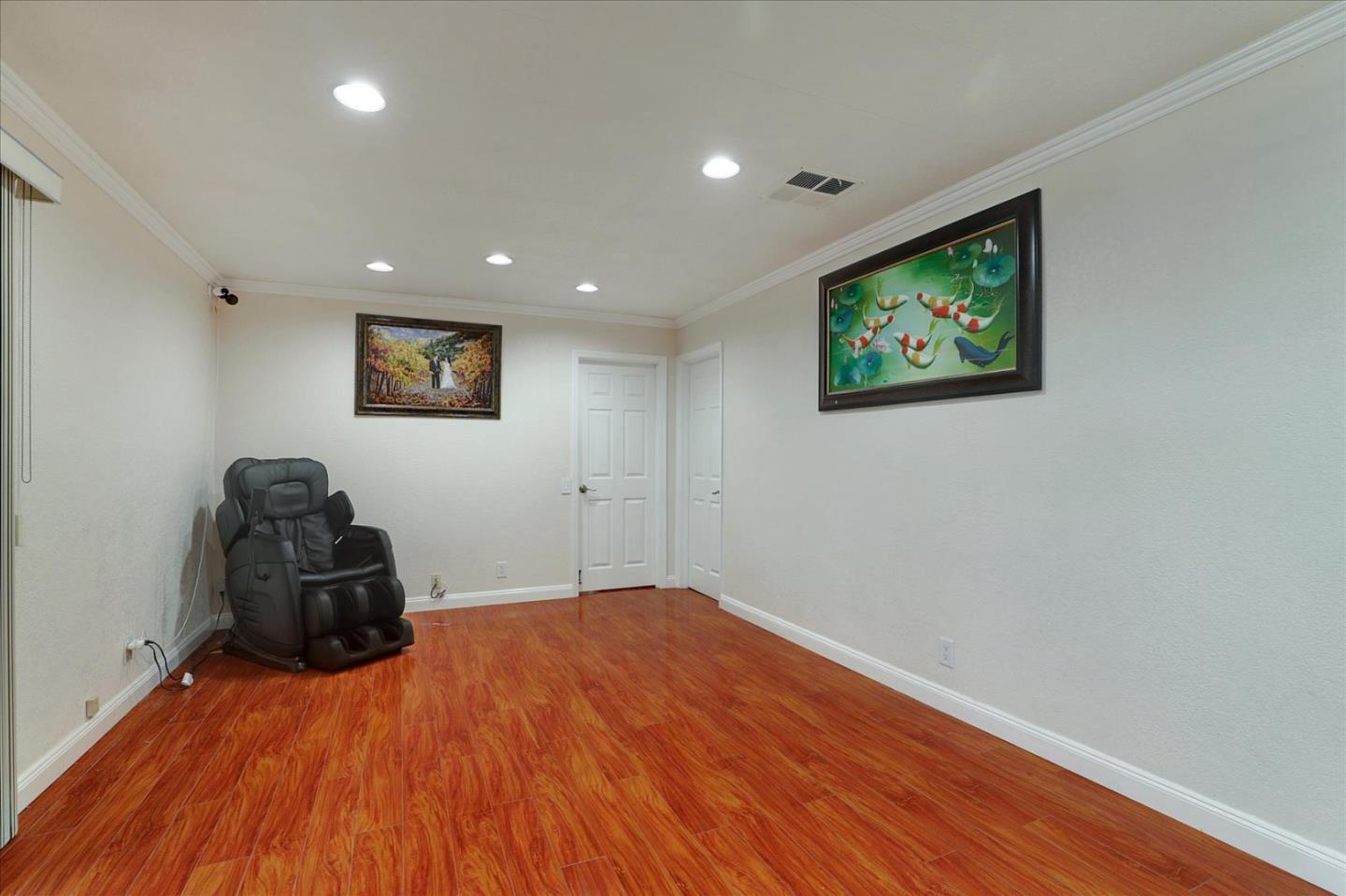 5450 Monterey Road, Unit 168 San Jose, CA 95111 - Photo 13 of 56 a bedroom with a bed and a painting on the wall
