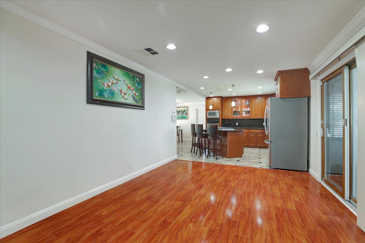 5450 Monterey Road, Unit 168 San Jose, CA 95111 - Photo 16 of 56 a view of a kitchen with a refrigerator and wooden floor