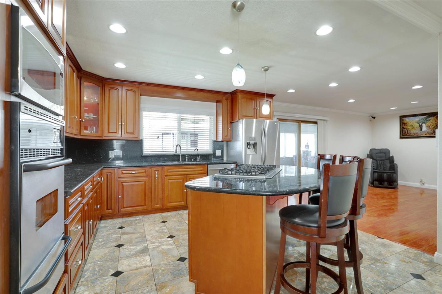 5450 Monterey Road, Unit 168 San Jose, CA 95111 - Photo 17 of 56 a kitchen with stainless steel appliances granite countertop a sink and cabinets