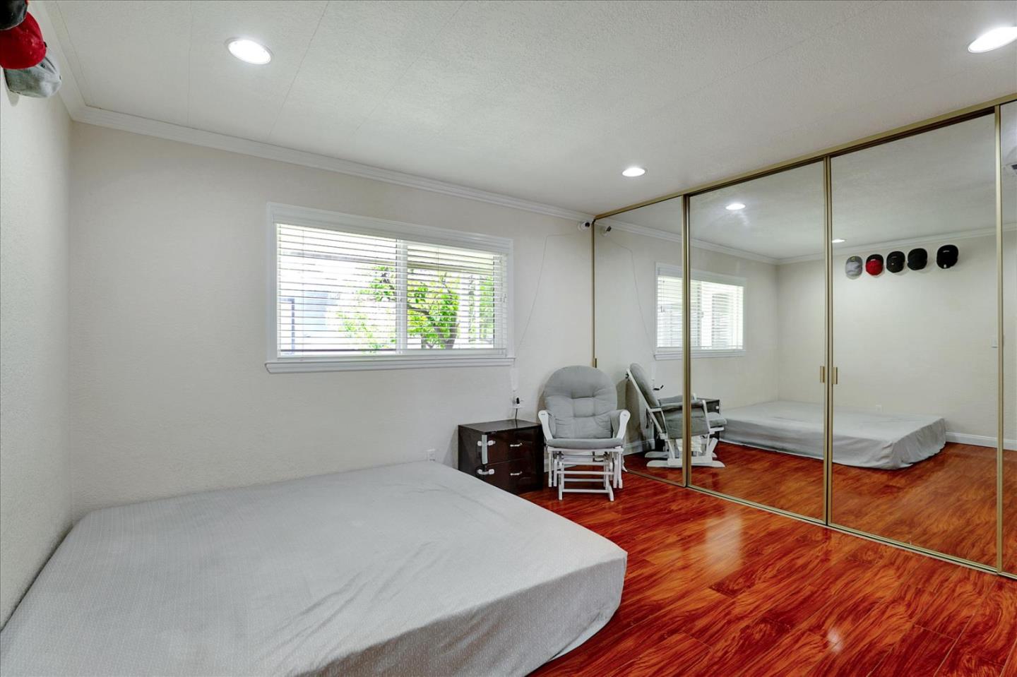 5450 Monterey Road, Unit 168 San Jose, CA 95111 - Photo 32 of 56 a living room with furniture a window and wooden floor