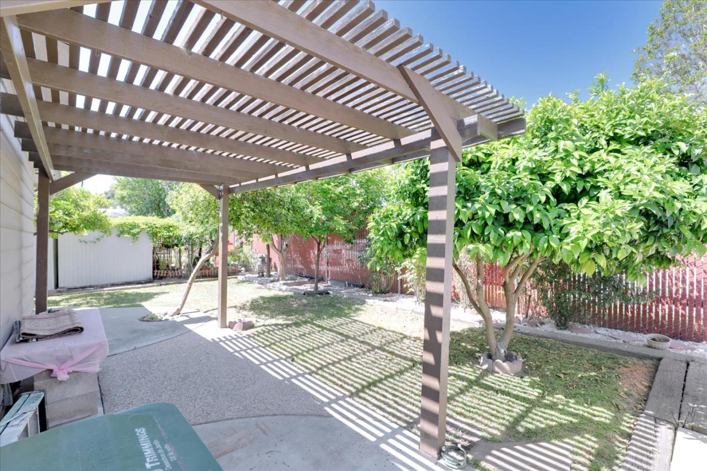 5450 Monterey Road, Unit 168 San Jose, CA 95111 - Photo 47 of 56 a backyard of a house with a swing table and chairs