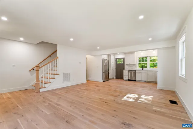 a kitchen with a stove a refrigerator and a sink