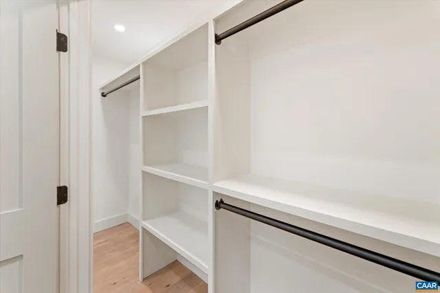 a spacious bathroom with double sink and a mirror
