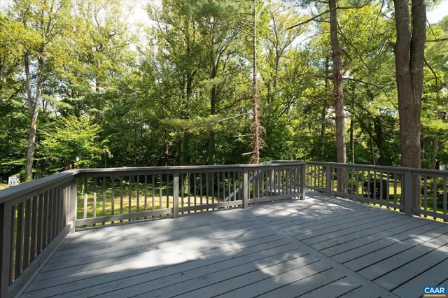 a view of balcony with deck and wooden floor