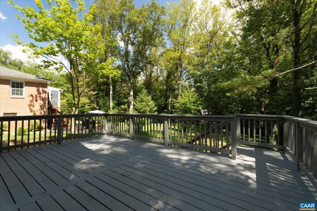 a view of a house with wooden deck