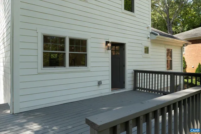 a view of a wooden house with a deck