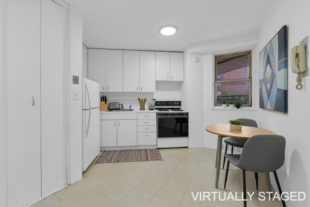 5800 Arlington Avenue, Unit 2R Bronx, NY 10471 - Photo 2 of 19 a kitchen with stainless steel appliances a stove a sink refrigerator and a chair