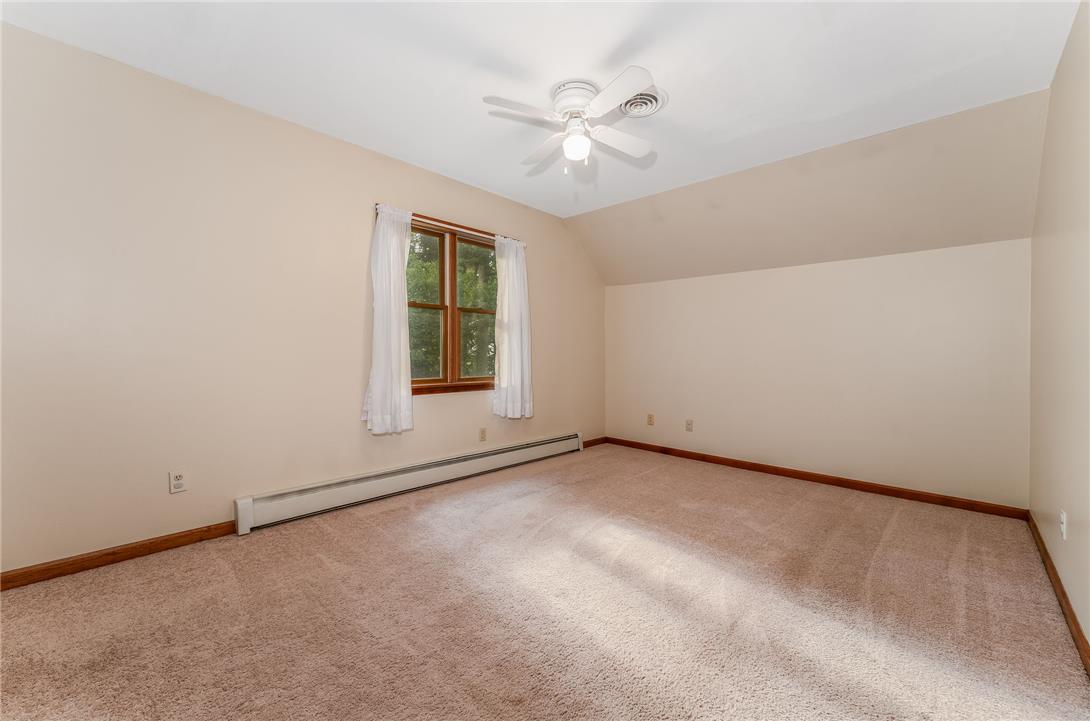 465 Raubsville Road Easton, PA 18042 - Photo 34 of 60 Well-lit room with plush carpeting and a modern ceiling fan, offering a serene atmosphere.