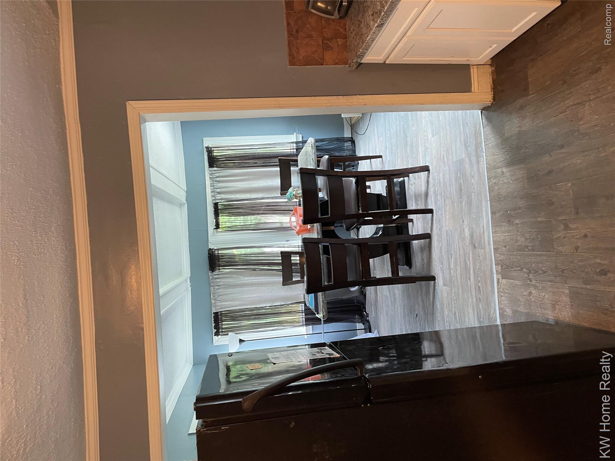 19350 Glastonbury Road Detroit, MI 48219 - Photo 7 of 11 Dining area featuring wood-finish flooring and a coffered ceiling