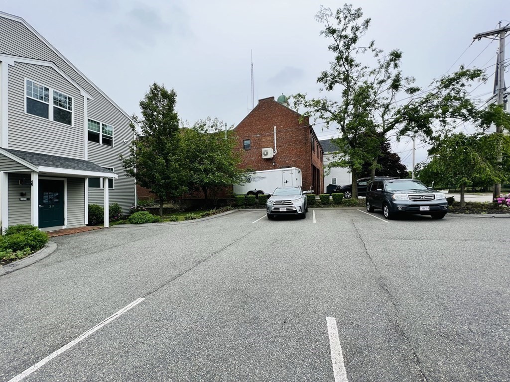 39 Athens Street, Unit 1 Weymouth, MA 02191 - Photo 13 of 13 a car parked in front of a house