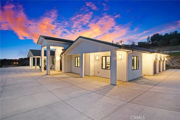 a view of a house with entertaining space