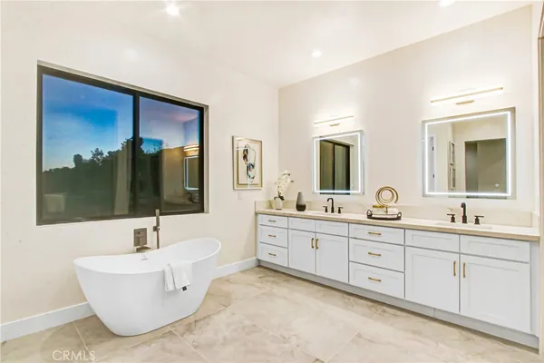 a bathroom with a shower and a sink