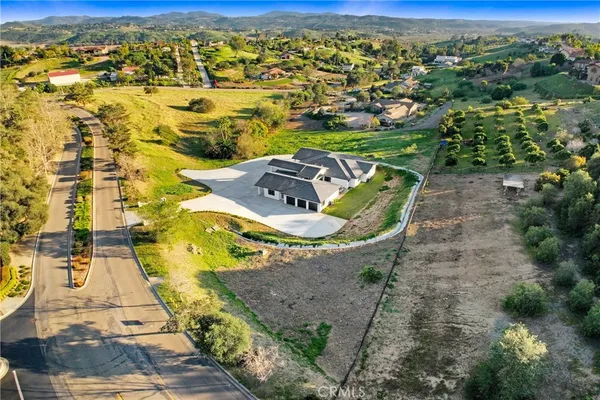 an aerial view of residential house with outdoor space