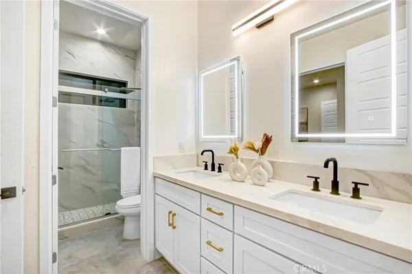 a bedroom with a bed and a mirror