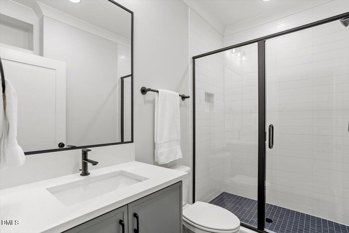 811 Maple Berry Lane, Unit 101 Raleigh, NC 27607 - Photo 38 of 45 a bathroom with a sink toilet and shower