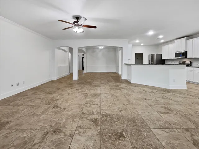 a view of a kitchen with a sink and a stove top oven