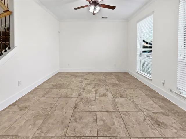 a view of an empty room and a window