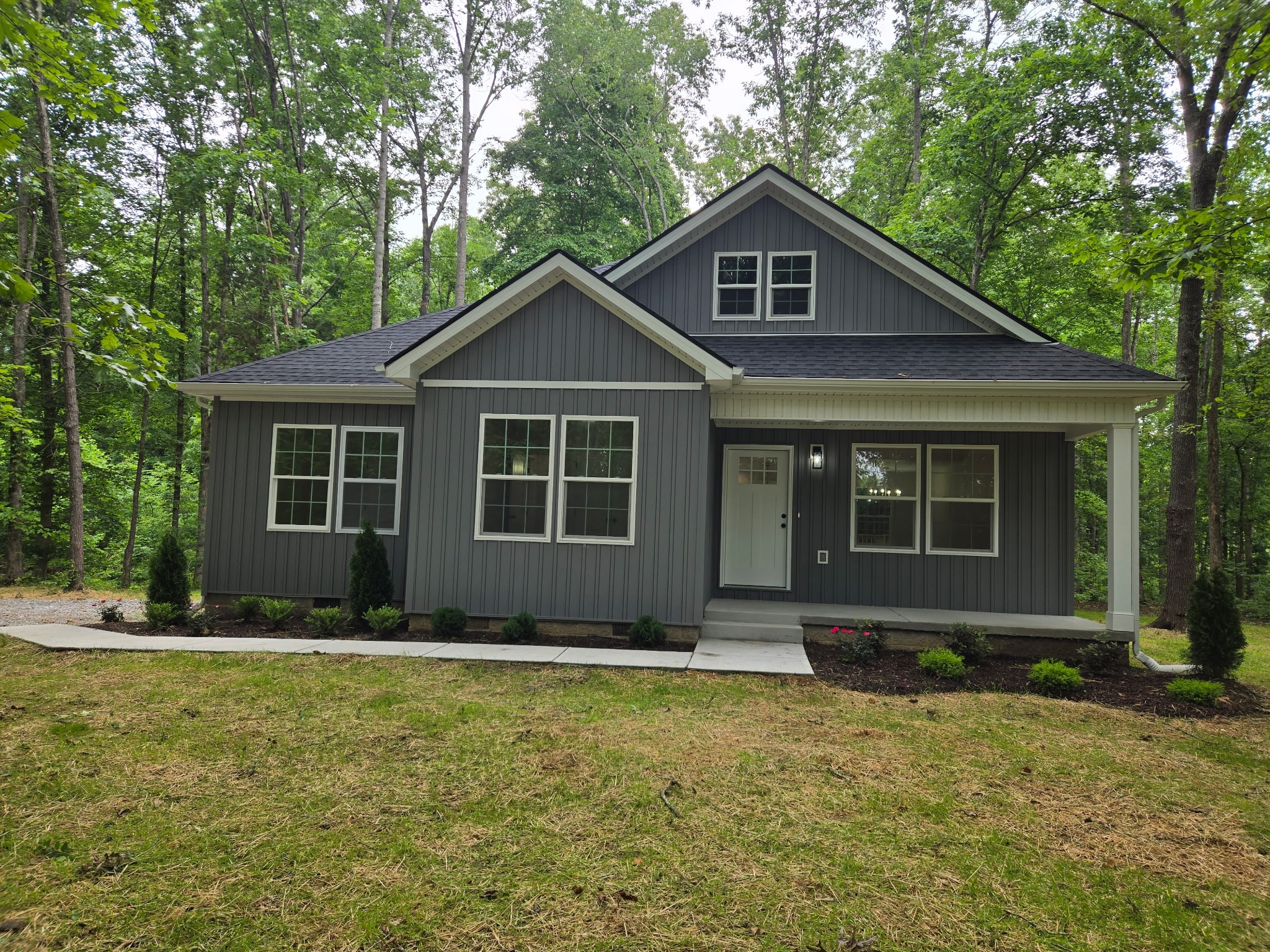 a front view of a house with a yard