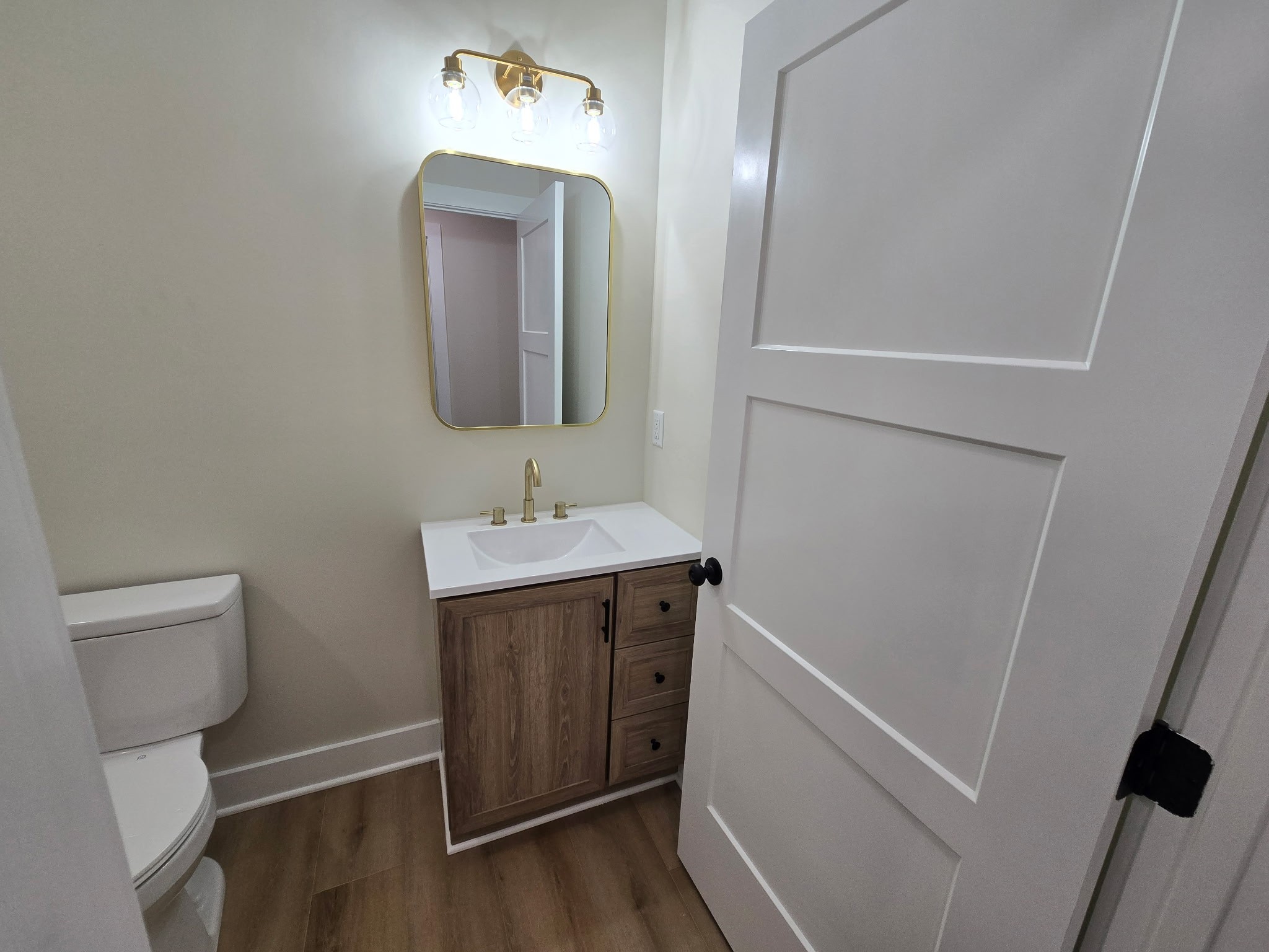 841 Lucas Road Dickson, TN 37055 - Photo 16 of 21 a bathroom with a sink a toilet and a mirror