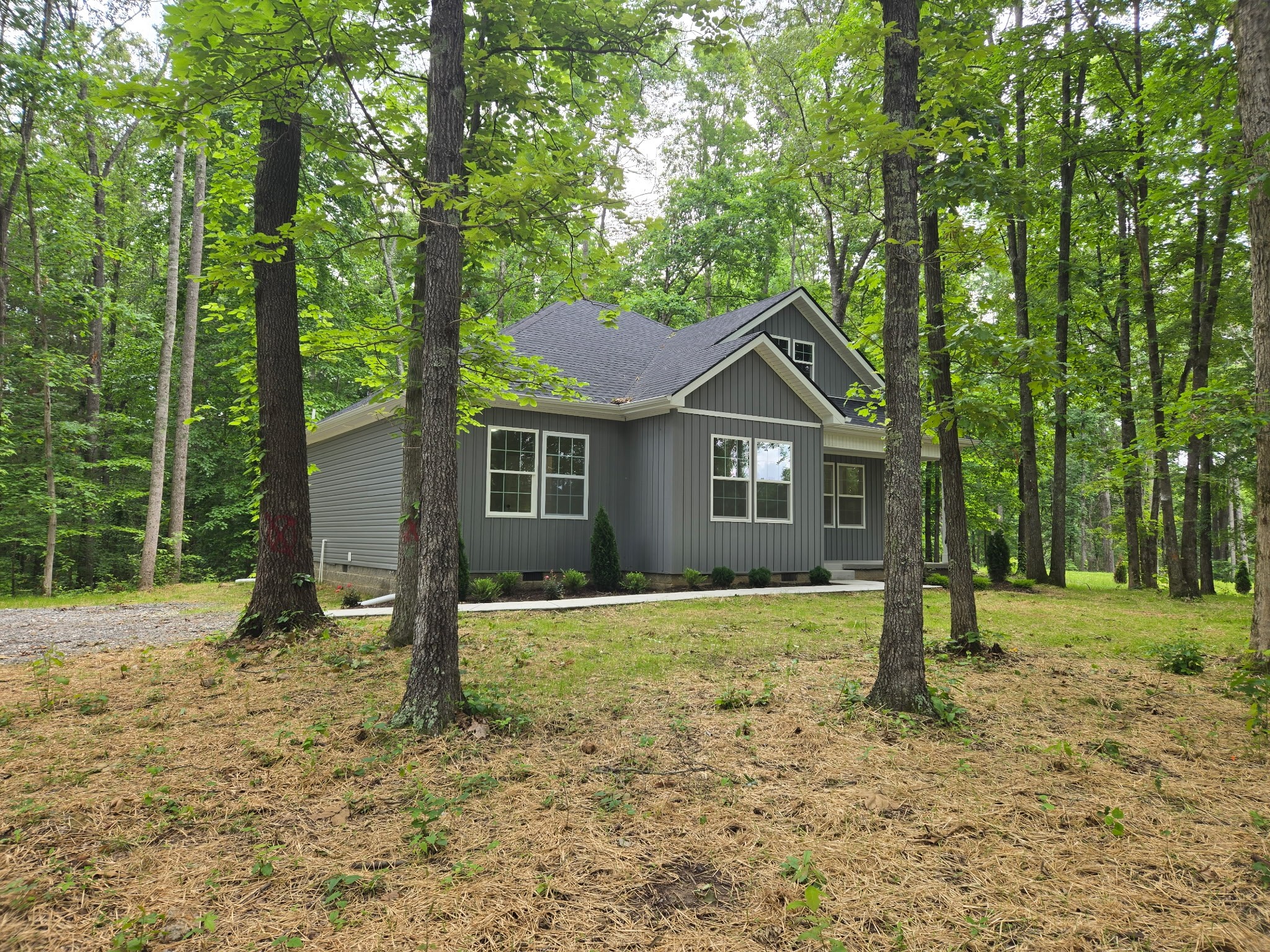 841 Lucas Road Dickson, TN 37055 - Photo 19 of 21 a house with trees in the background