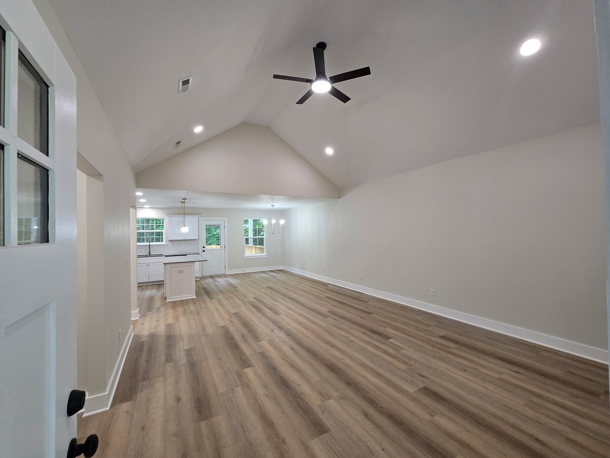 841 Lucas Road Dickson, TN 37055 - Photo 6 of 21 a view of a livingroom with a hardwood floor and a ceiling fan