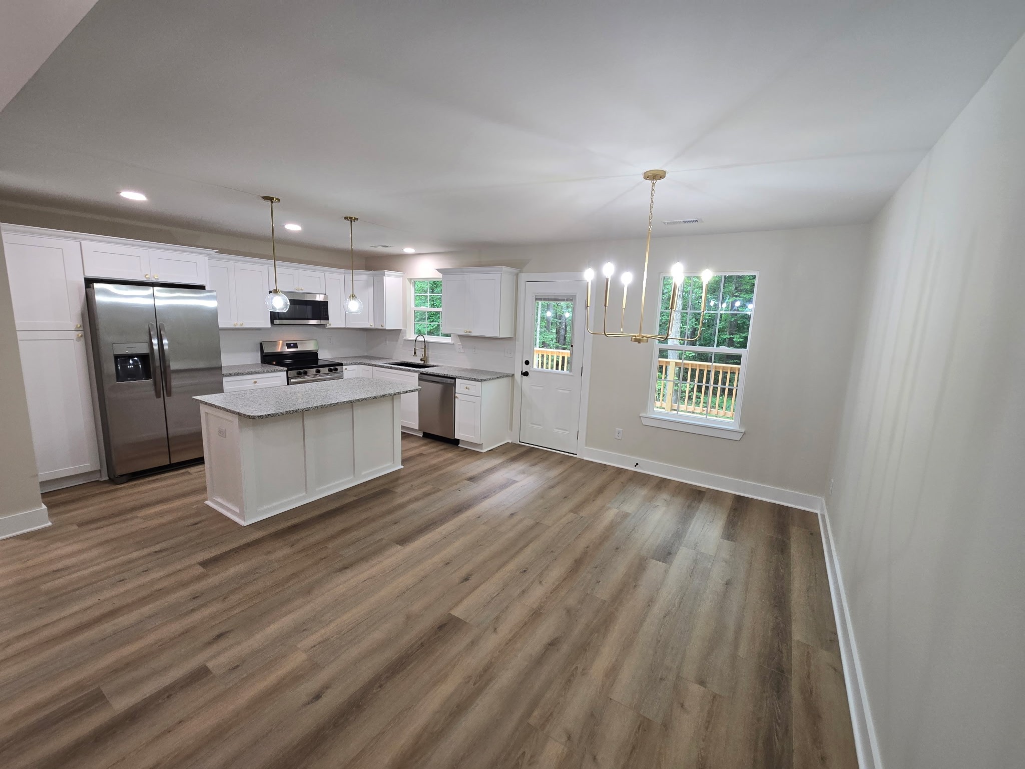 841 Lucas Road Dickson, TN 37055 - Photo 7 of 21 a kitchen with stainless steel appliances a refrigerator sink and wooden floor