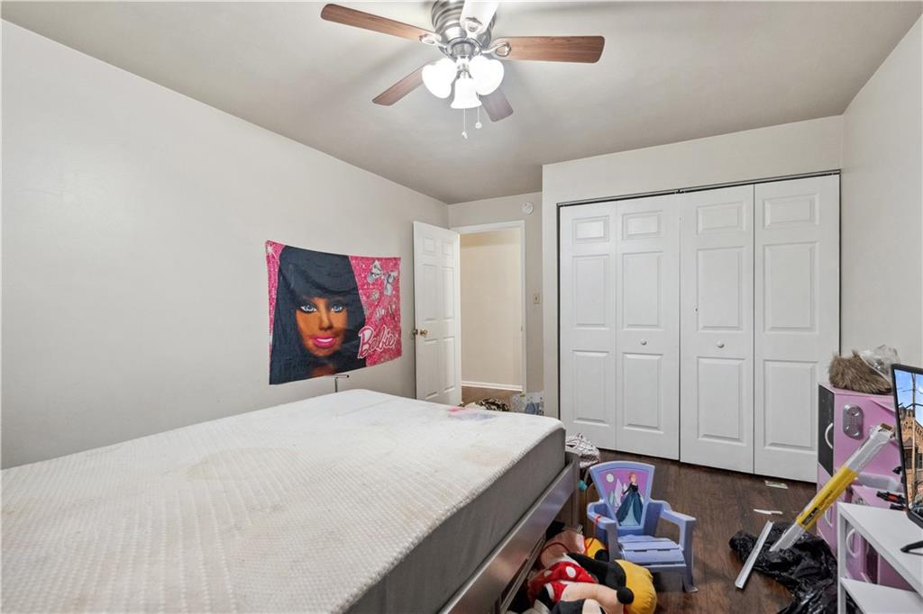 103 Ella Street McKees Rocks, PA 15136 - Photo 12 of 37 a bedroom with a bed and a chandelier
