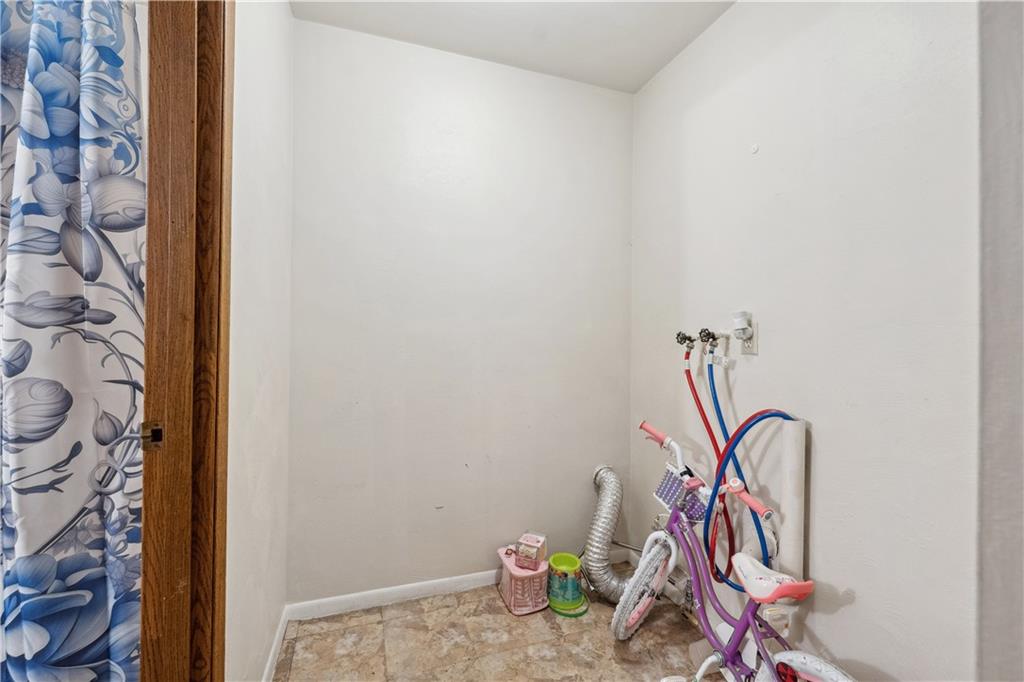 103 Ella Street McKees Rocks, PA 15136 - Photo 9 of 37 a view of a storage and utility room with rack on the wall