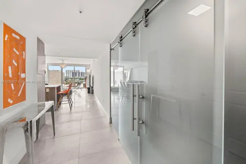 a dining room with furniture and a livingroom view