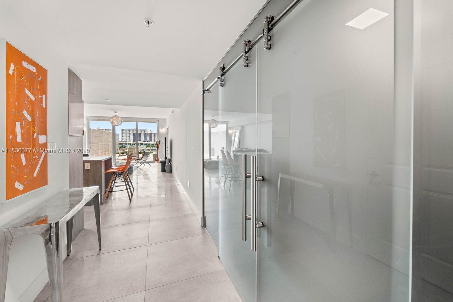 400 Sunny Isles Boulevard, Unit 616 Sunny Isles Beach, FL 33160 - Photo 9 of 19 a dining room with furniture and a livingroom view