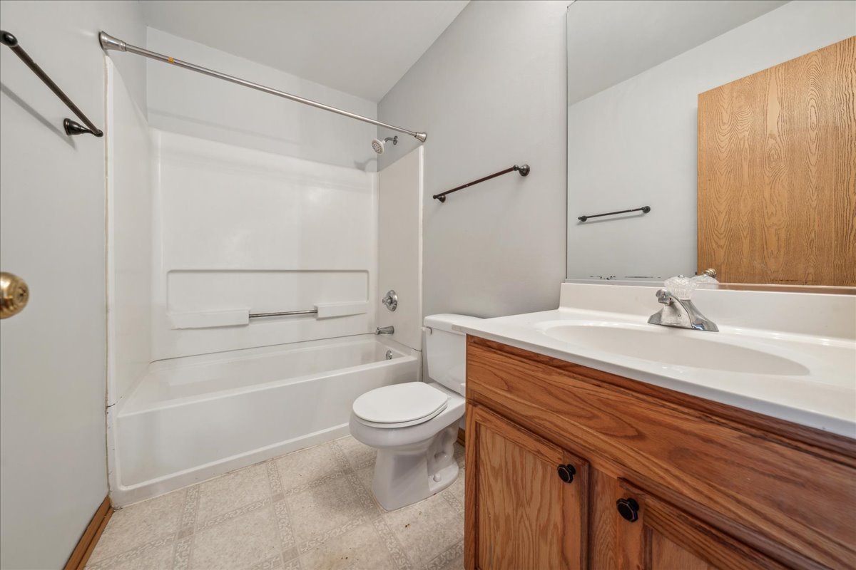 746 County Line Road Aurora, IL 60502 - Photo 11 of 16 a bathroom with a sink a toilet and shower