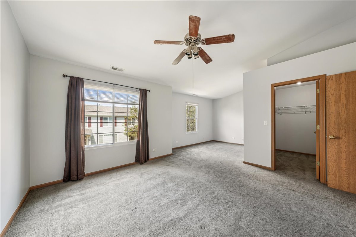 746 County Line Road Aurora, IL 60502 - Photo 13 of 16 a view of a livingroom with a ceiling fan and window