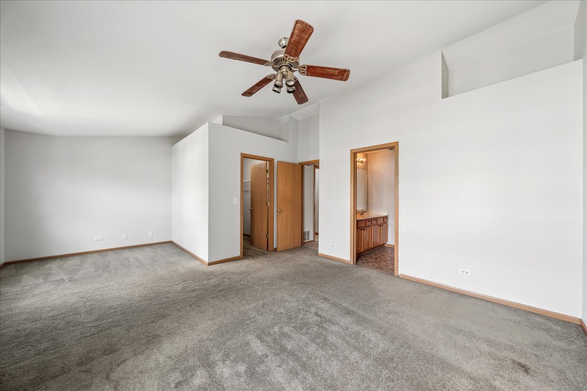 746 County Line Road Aurora, IL 60502 - Photo 14 of 16 a view of a livingroom with a ceiling fan and window