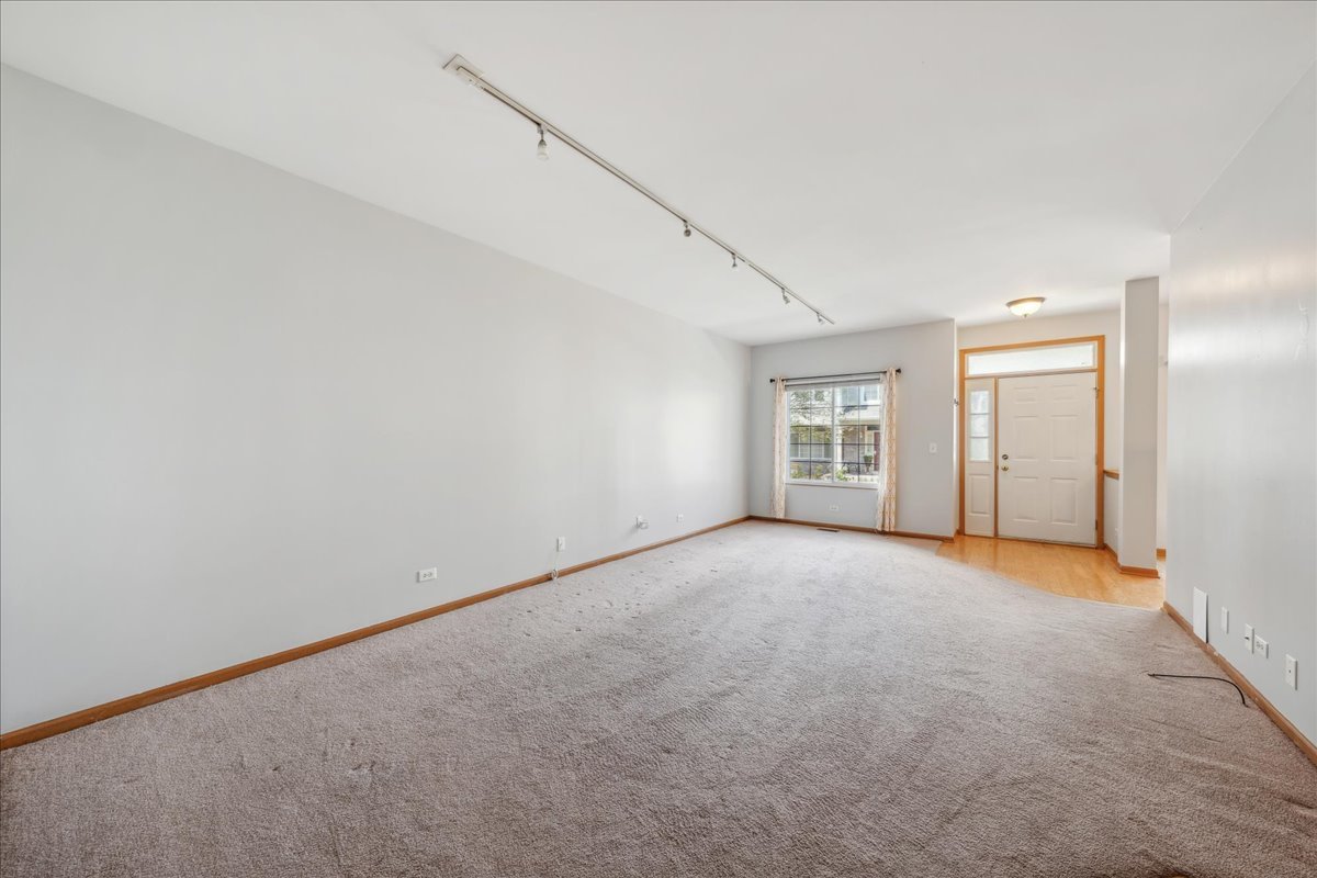 746 County Line Road Aurora, IL 60502 - Photo 3 of 16 a view of an empty room with a window