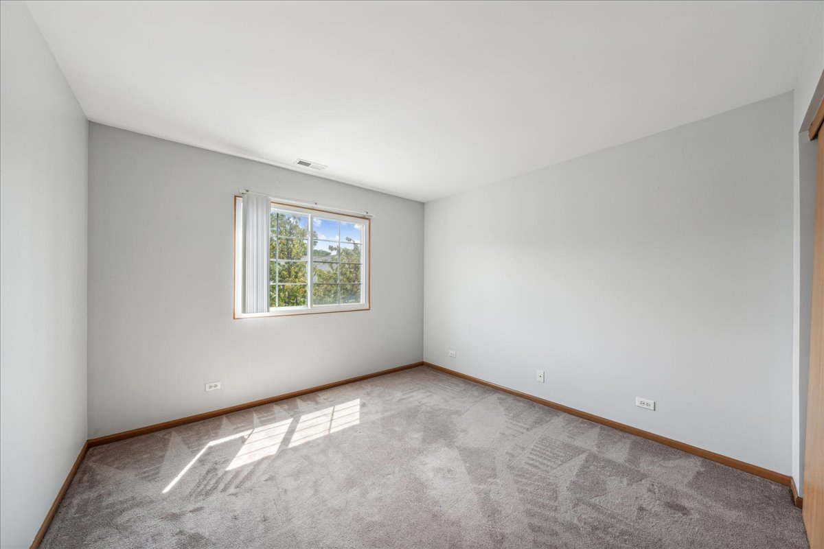 746 County Line Road Aurora, IL 60502 - Photo 10 of 16 an empty room with a window