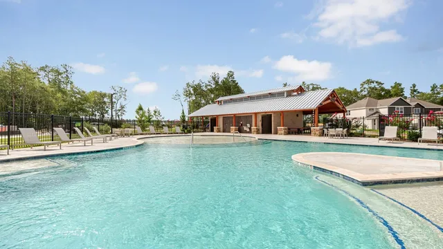 a front view of a house with swimming pool and porch
