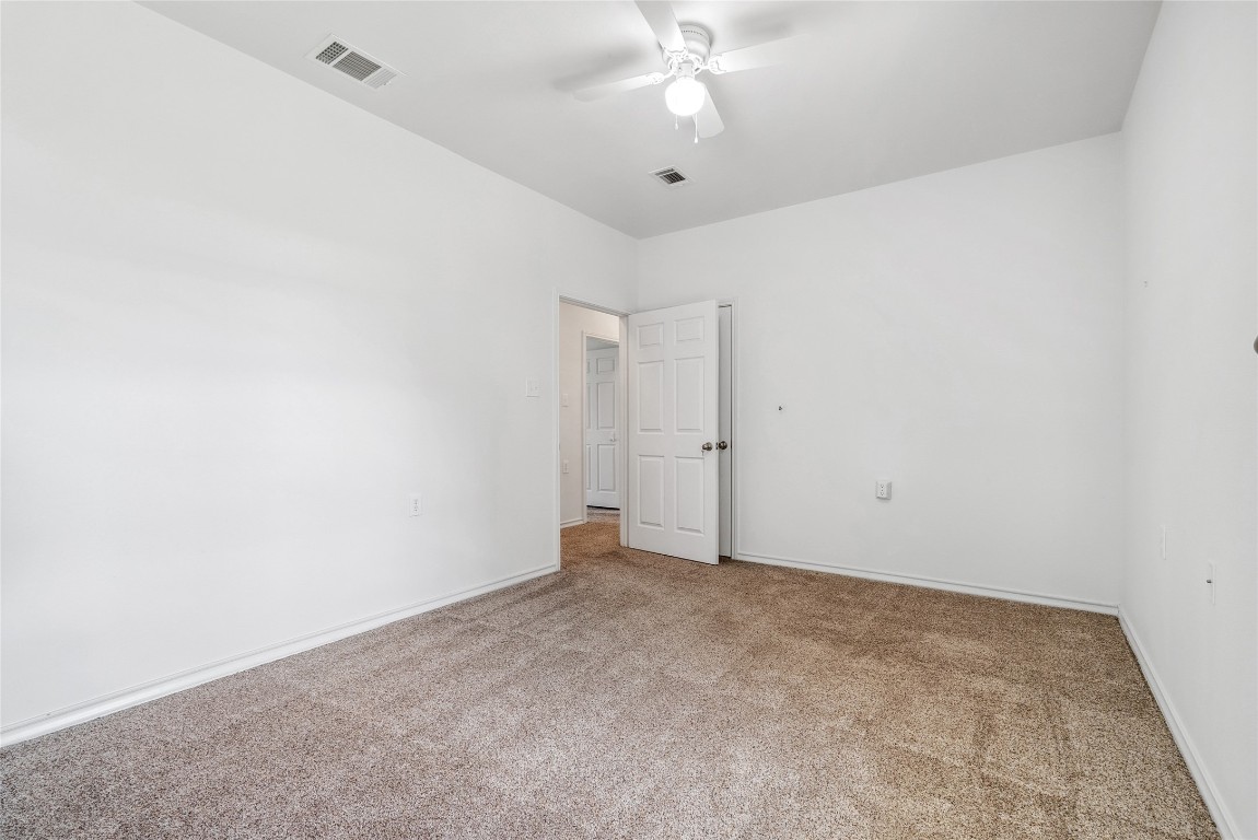 826 Savannah Cove Elgin, TX 78621 - Photo 15 of 35 Secondary bedroom with exterior door access and hall bathroom