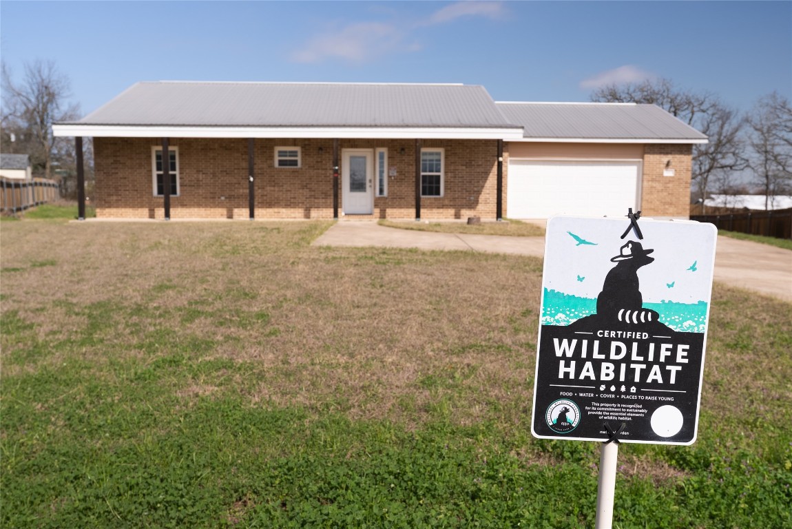 826 Savannah Cove Elgin, TX 78621 - Photo 31 of 35 Large Front View Yard Butterfly sactuary