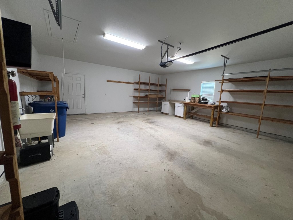 826 Savannah Cove Elgin, TX 78621 - Photo 33 of 35 Oversized two car garage with room for a workshop