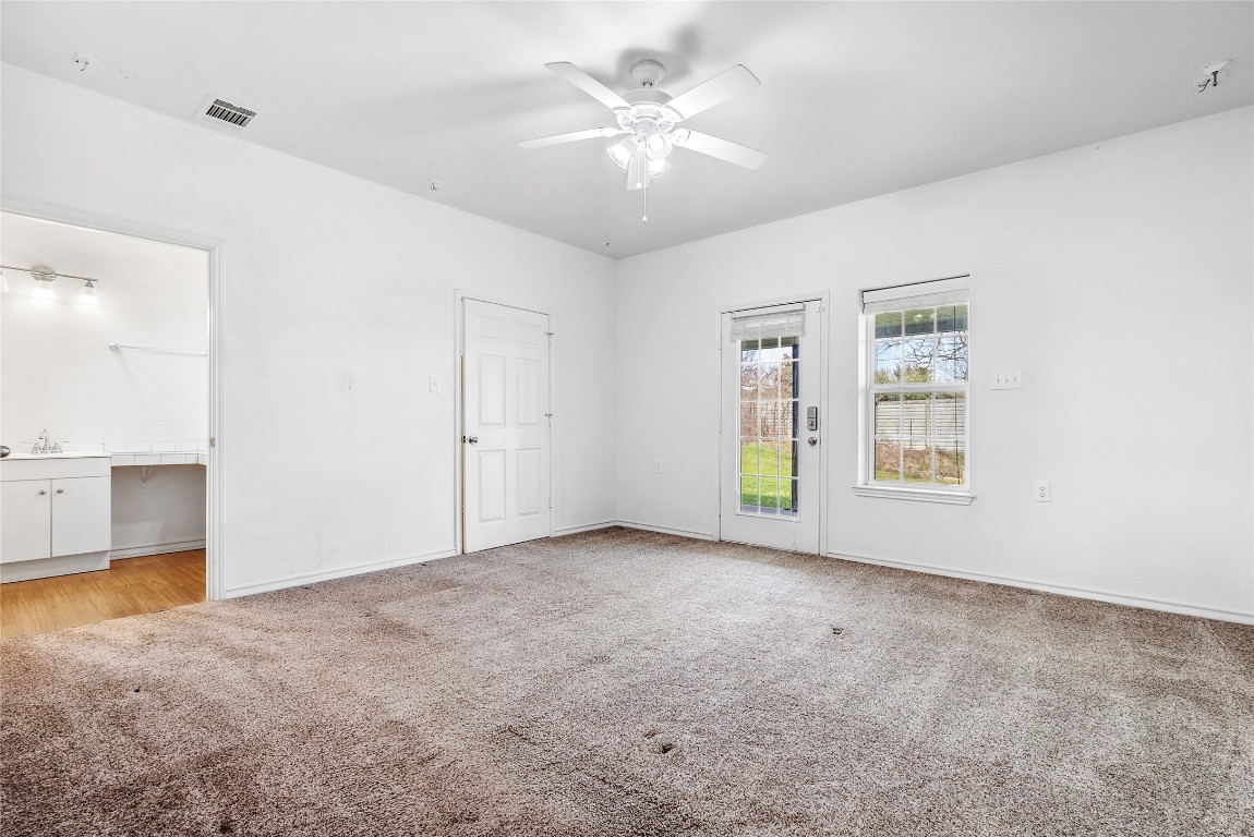 826 Savannah Cove Elgin, TX 78621 - Photo 6 of 35 Primary Bedroom has exterior door