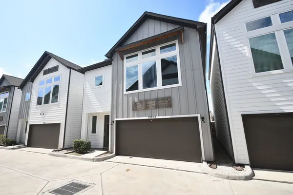 a front view of a house with yard