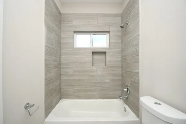 a bathroom with a shower and bathtub