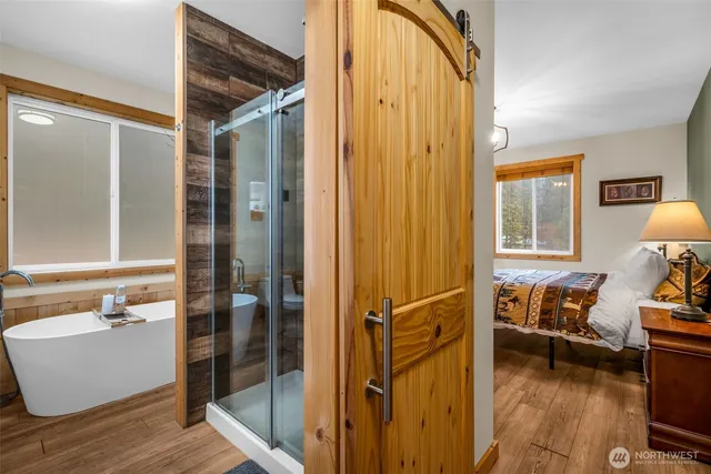 a bathroom with a tub and shower