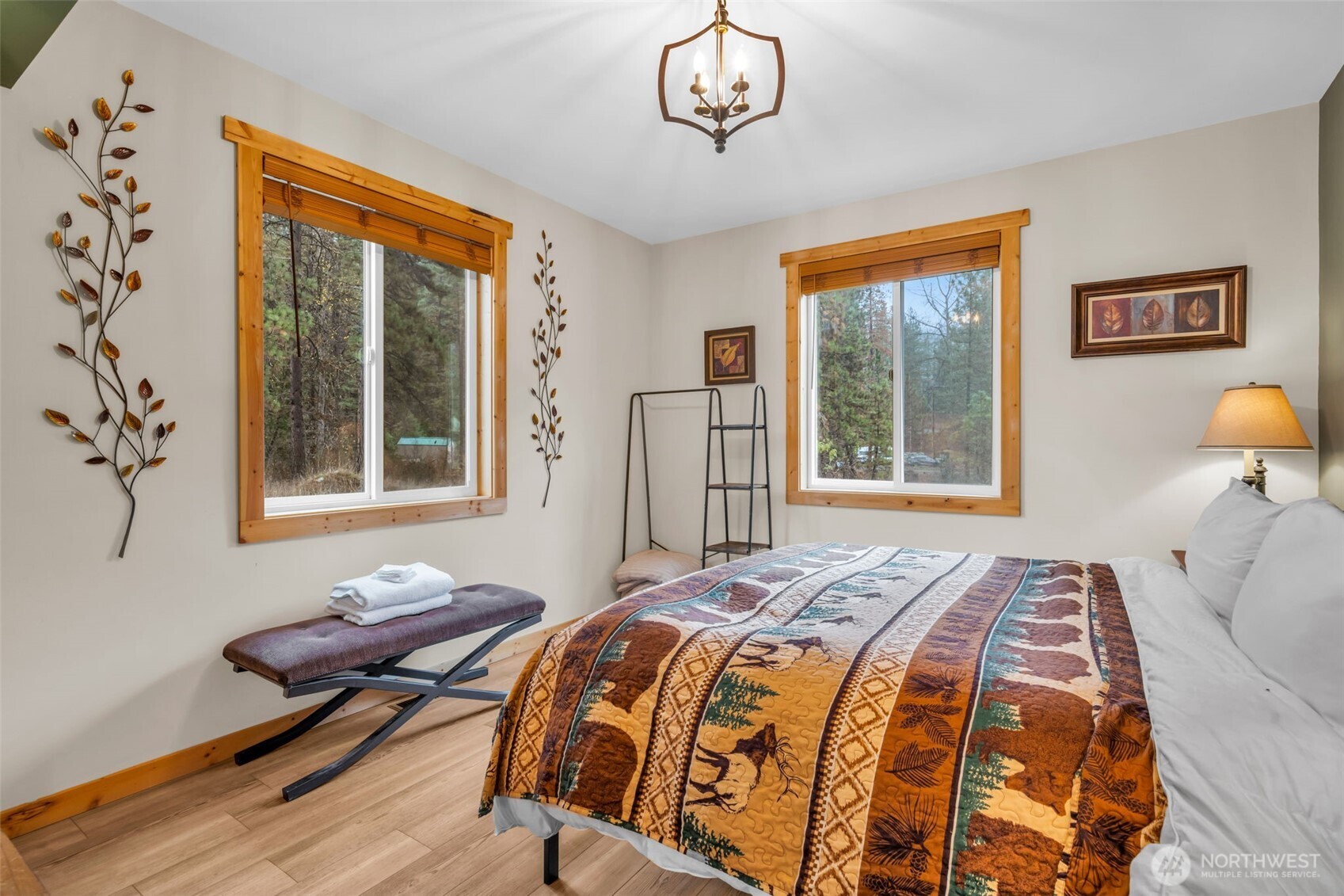 11650 Eagle Creek Road Leavenworth, WA 98826 - Photo 14 of 38 a bedroom with a bed and wooden floor