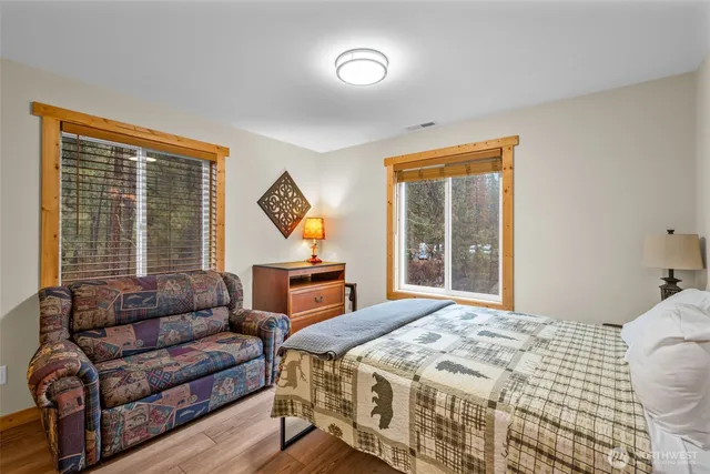 a bedroom with a bed and a couch